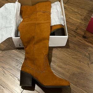 New still in box size 7.5 womens high boot in cognac color.